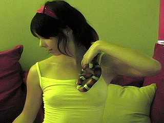 Ariel plays with her pet snake from Ariel Rebel 